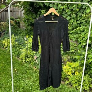 Thin sweater dress with crochet accents.